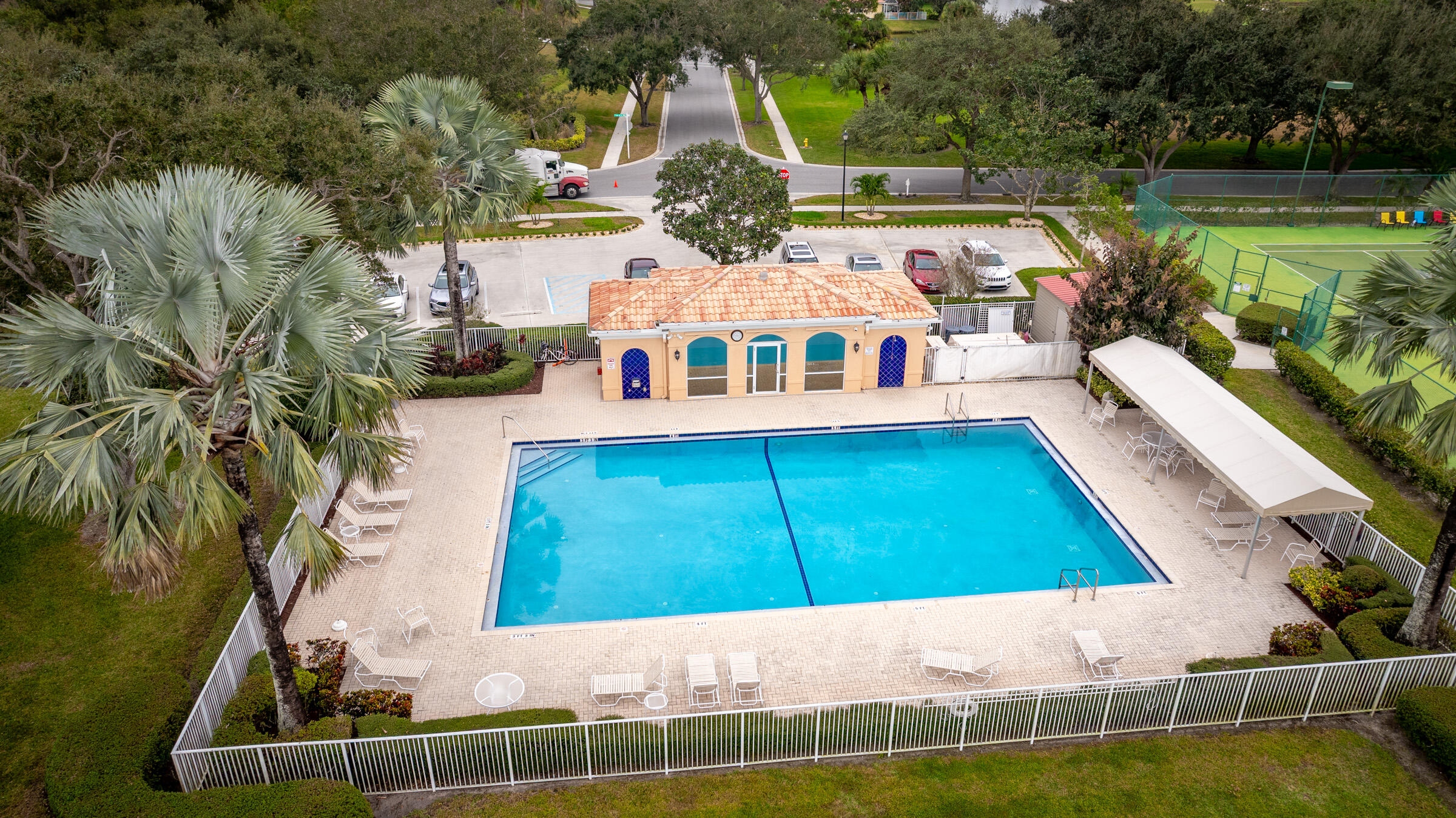 9520 Southwest Wedgewood Lane Stuart, FL 34997 - Photo 50 of 53 a aerial view of a house with swimming pool and large trees
