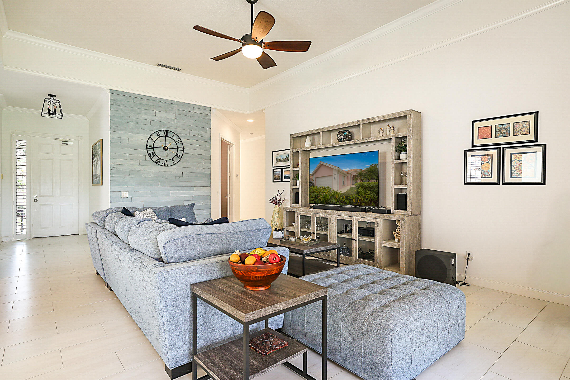 9520 Southwest Wedgewood Lane Stuart, FL 34997 - Photo 5 of 53 a living room with furniture and a flat screen tv