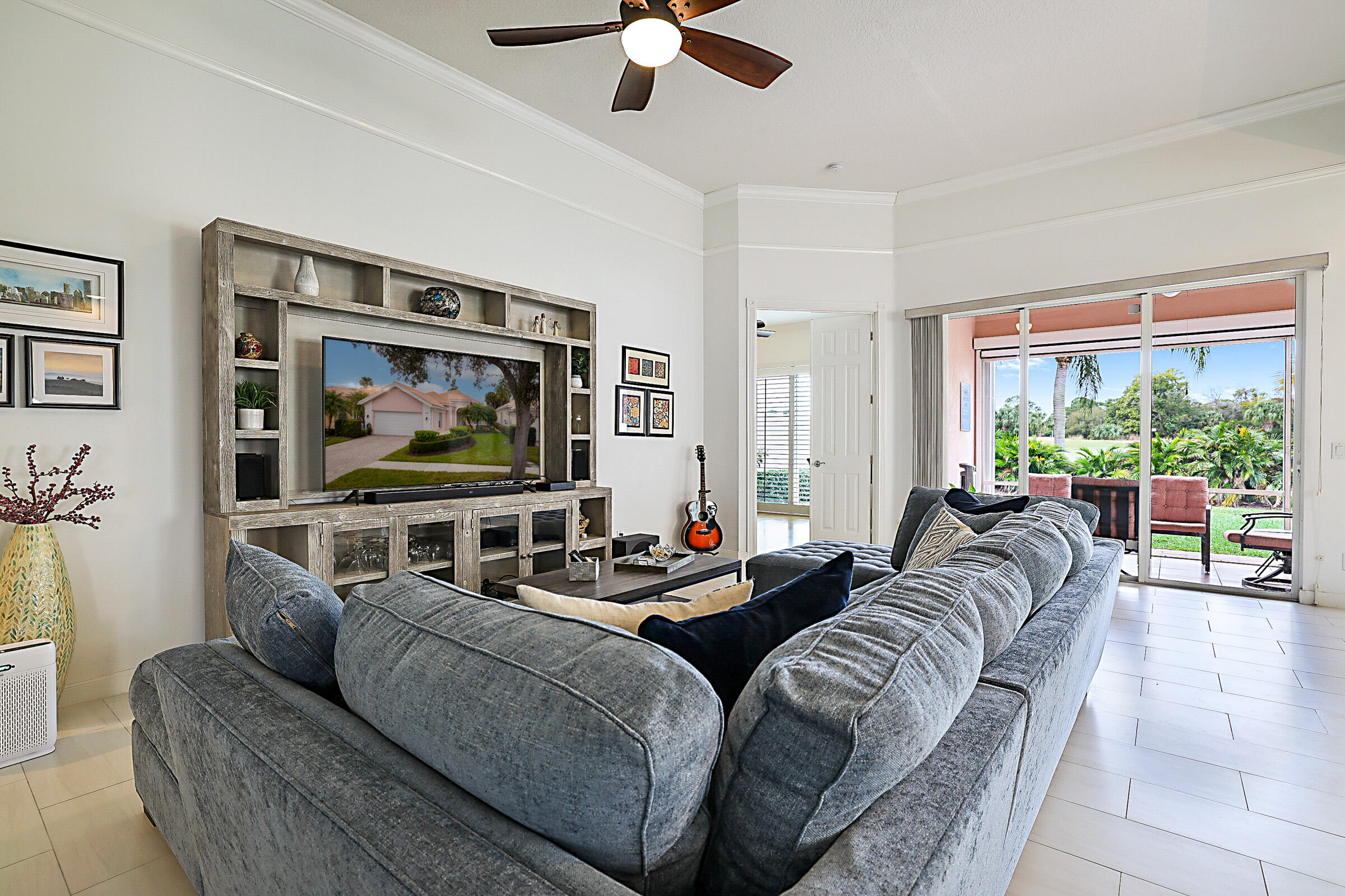9520 Southwest Wedgewood Lane Stuart, FL 34997 - Photo 6 of 53 a living room with furniture and a flat screen tv