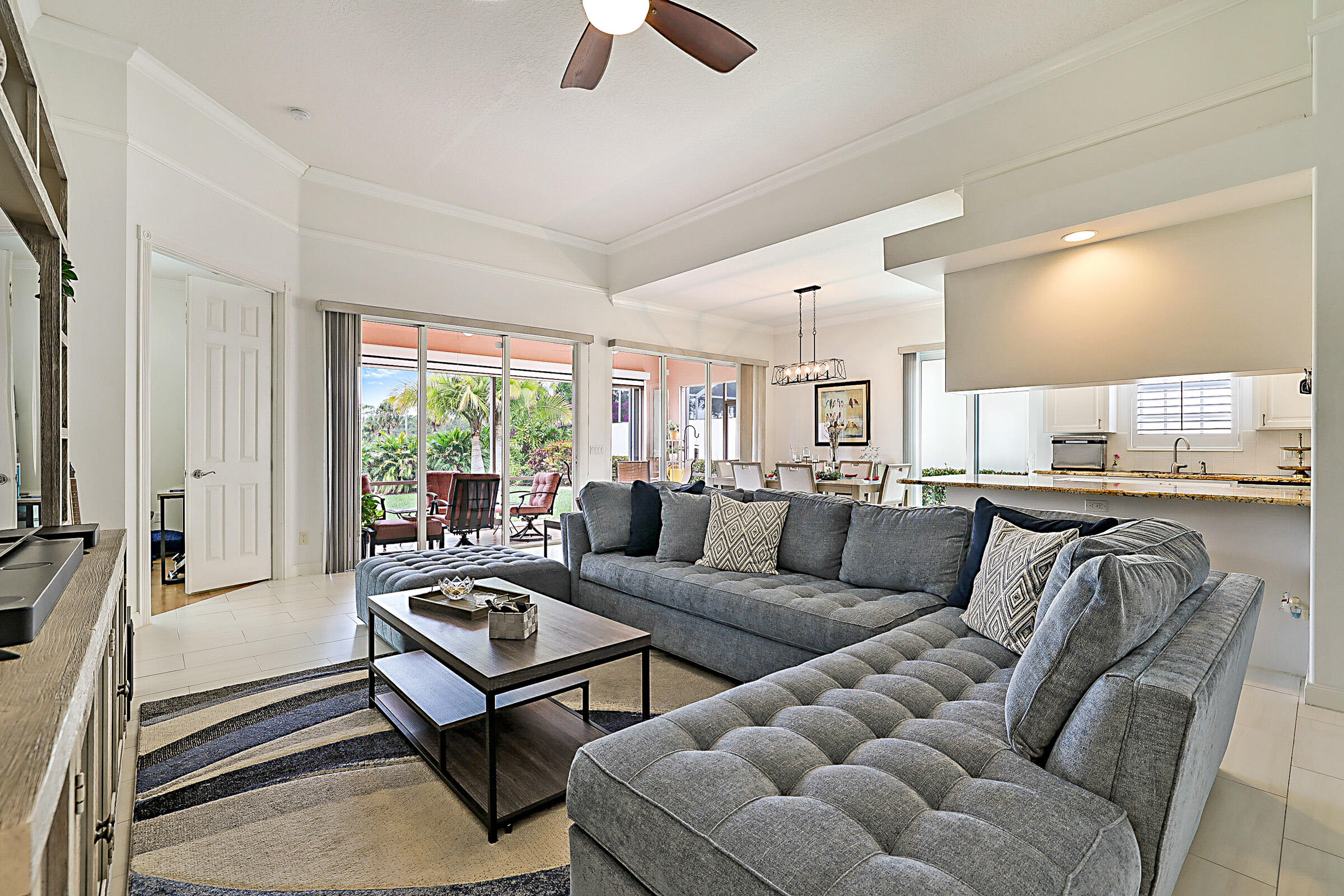 9520 Southwest Wedgewood Lane Stuart, FL 34997 - Photo 7 of 53 a living room with furniture ceiling fan and a window