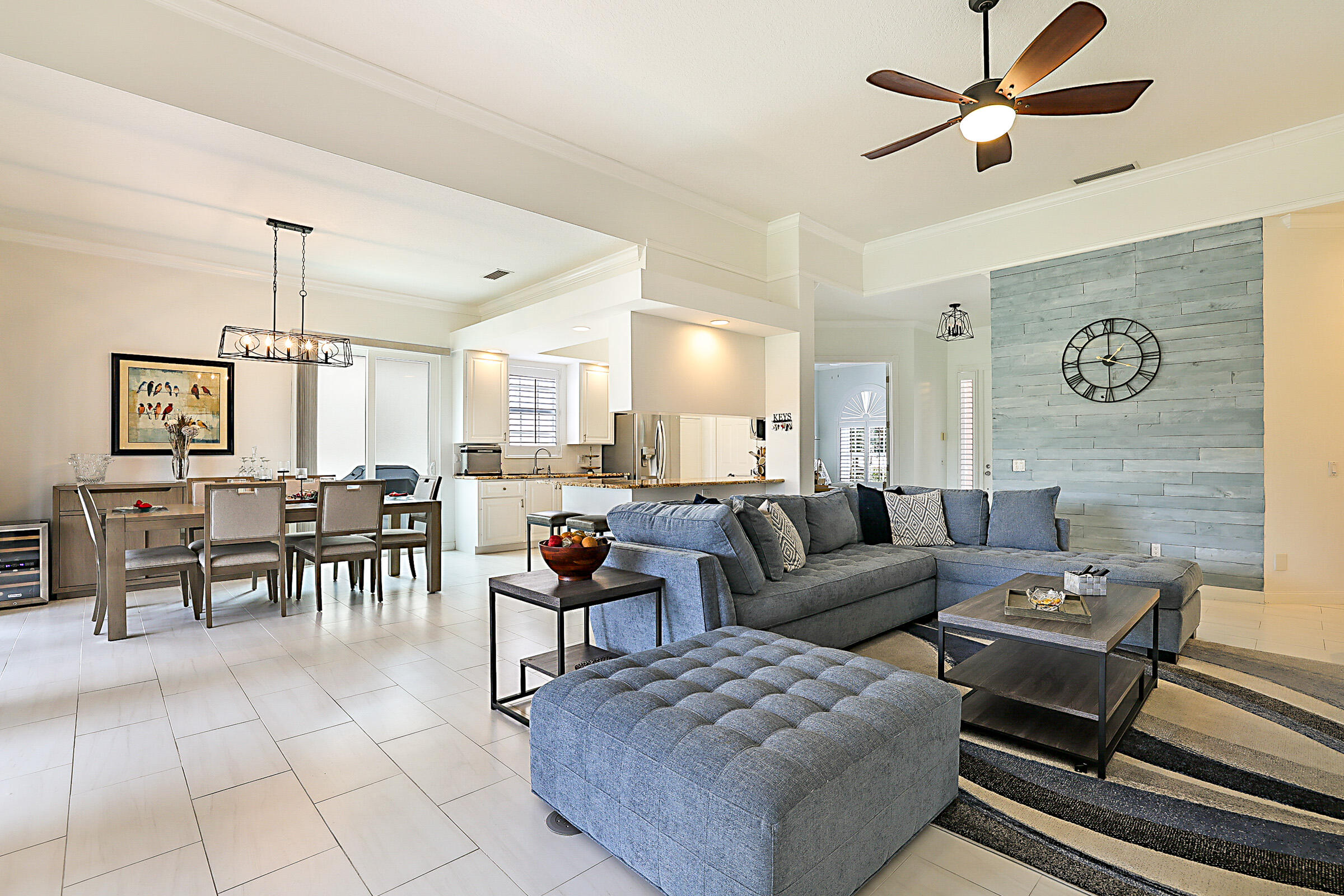 9520 Southwest Wedgewood Lane Stuart, FL 34997 - Photo 8 of 53 a living room with furniture and a dining table