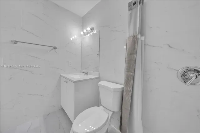 an empty room with a fan