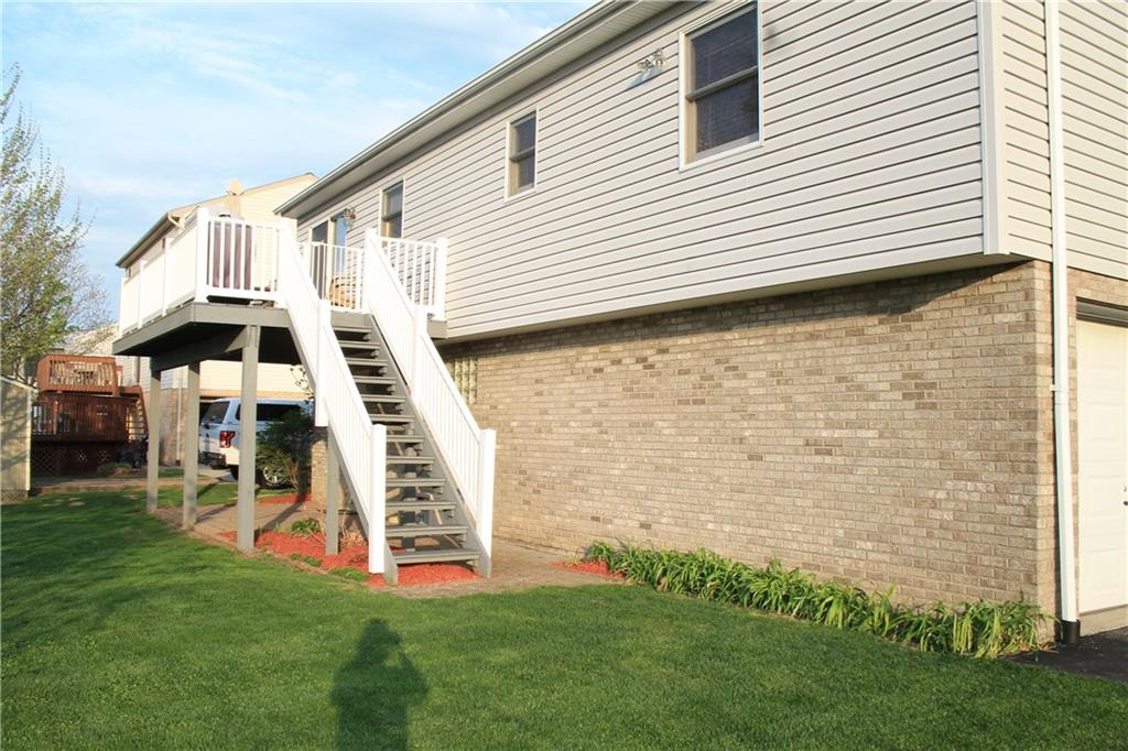 180 Barrington Ridge Delmont, PA 15626 - Photo 16 of 22 Beautiful Back yard with a deck and patio.