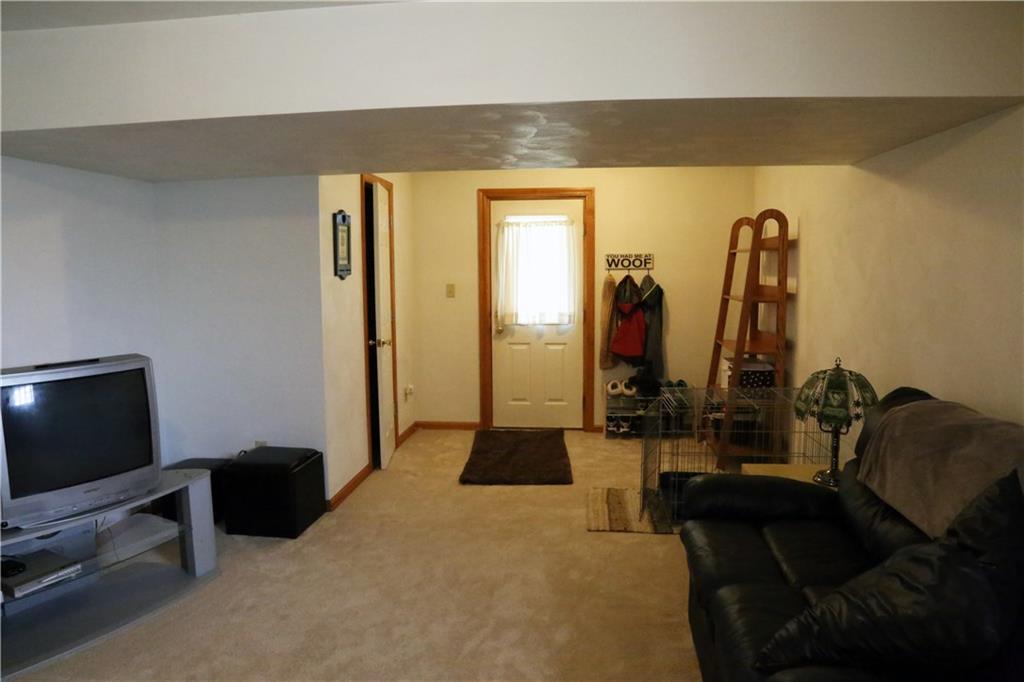 180 Barrington Ridge Delmont, PA 15626 - Photo 18 of 22 A large finished lower level features access to the covered patio and a half bath.