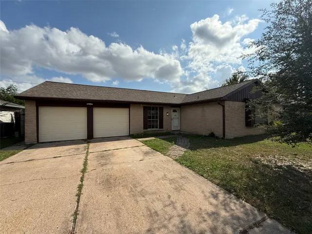 a house with yard in front of it