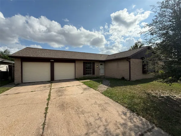 a house with yard in front of it