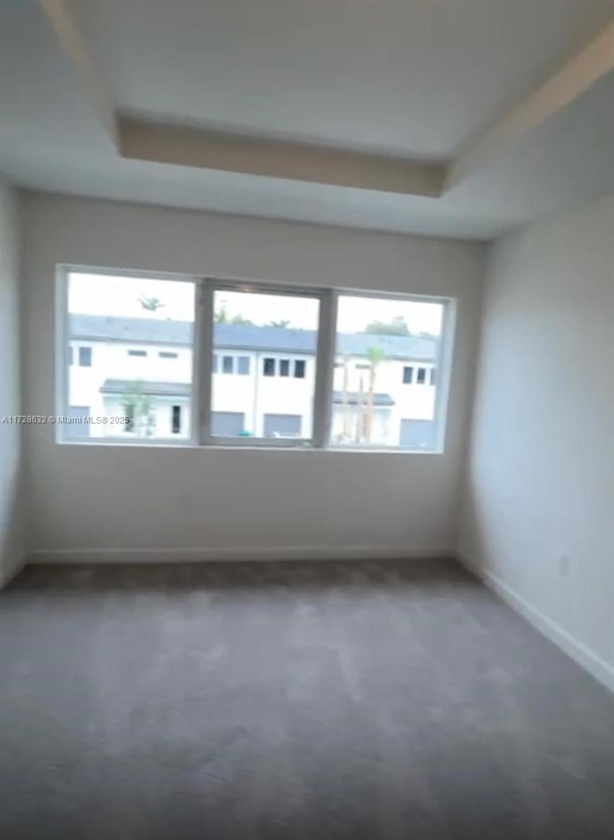5145 Southwest 37th Street, Unit 5145 Hollywood, FL 33023 - Photo 2 of 6 an empty room with a window