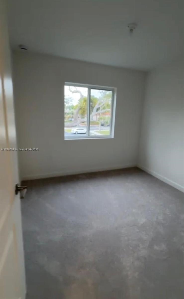 5145 Southwest 37th Street, Unit 5145 Hollywood, FL 33023 - Photo 4 of 6 an empty room with a window