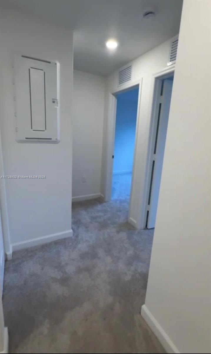 5145 Southwest 37th Street, Unit 5145 Hollywood, FL 33023 - Photo 5 of 6 an empty room with windows