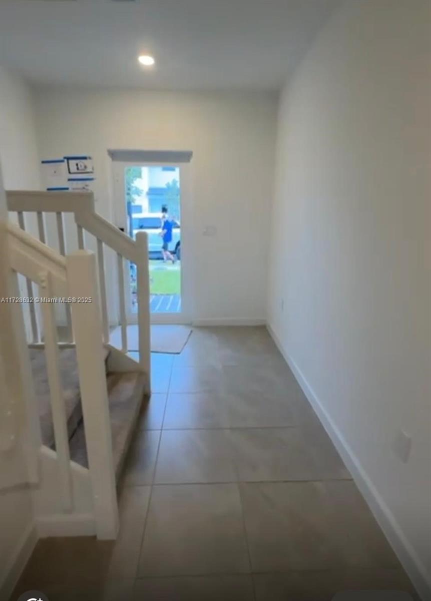 5145 Southwest 37th Street, Unit 5145 Hollywood, FL 33023 - Photo 6 of 6 a view of an entryway with wooden floor