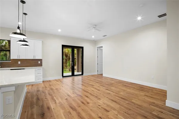 a view of a kitchen with a sink and a window