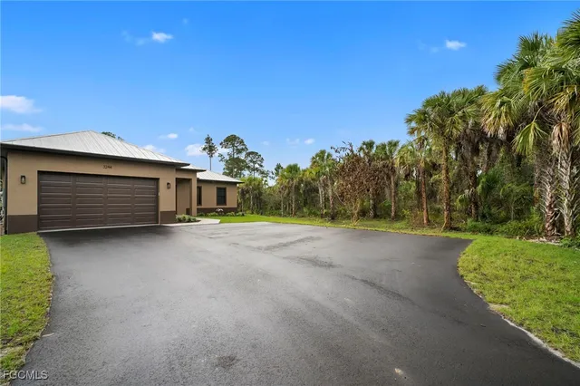 a view of a house with a garage