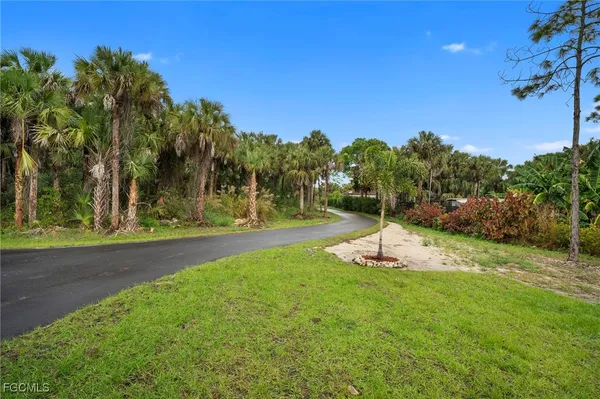a swimming pool with trees in the background