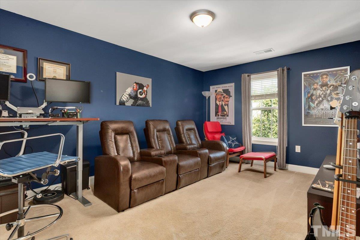 6 Piccadilly Court Durham, NC 27713 - Photo 14 of 27 a living room with furniture and a flat screen tv