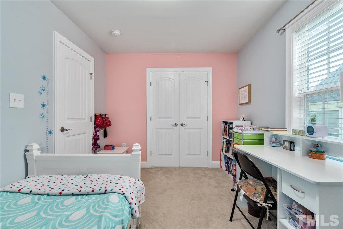 6 Piccadilly Court Durham, NC 27713 - Photo 17 of 27 a bedroom with a bed and a table