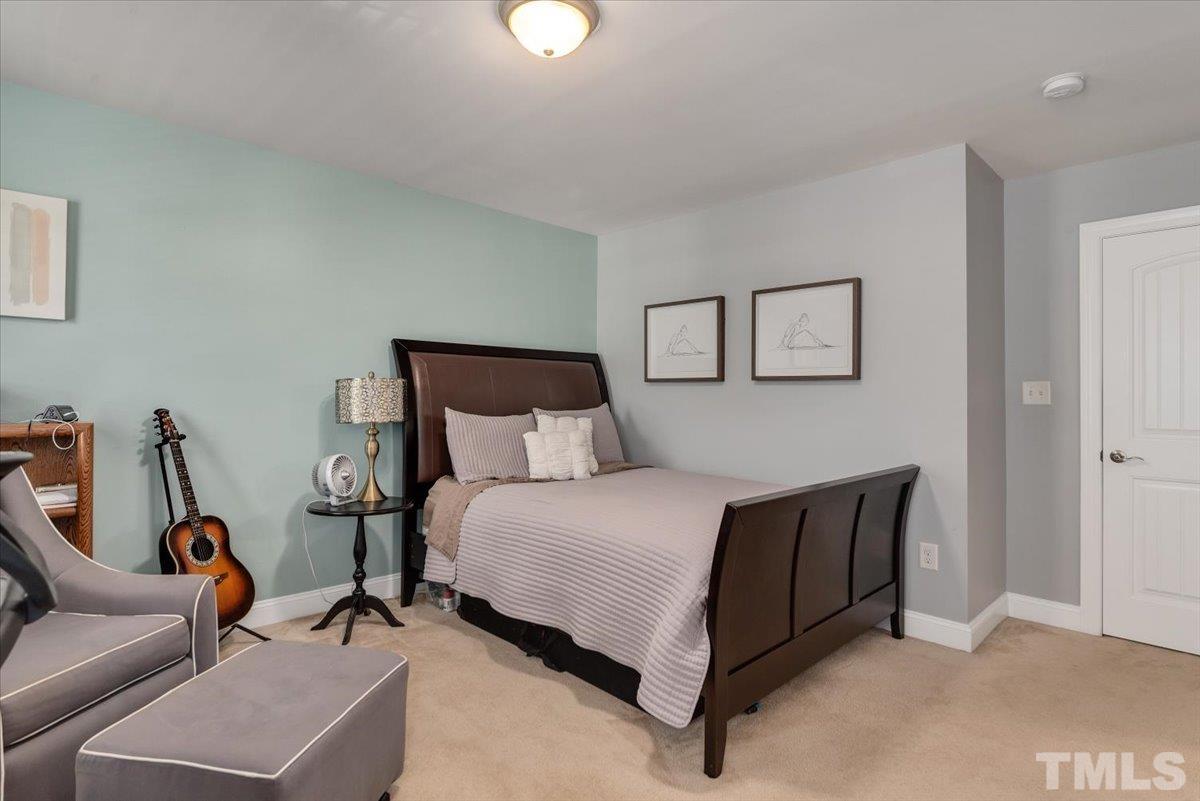 6 Piccadilly Court Durham, NC 27713 - Photo 18 of 27 a bedroom with a bed a couch and a window
