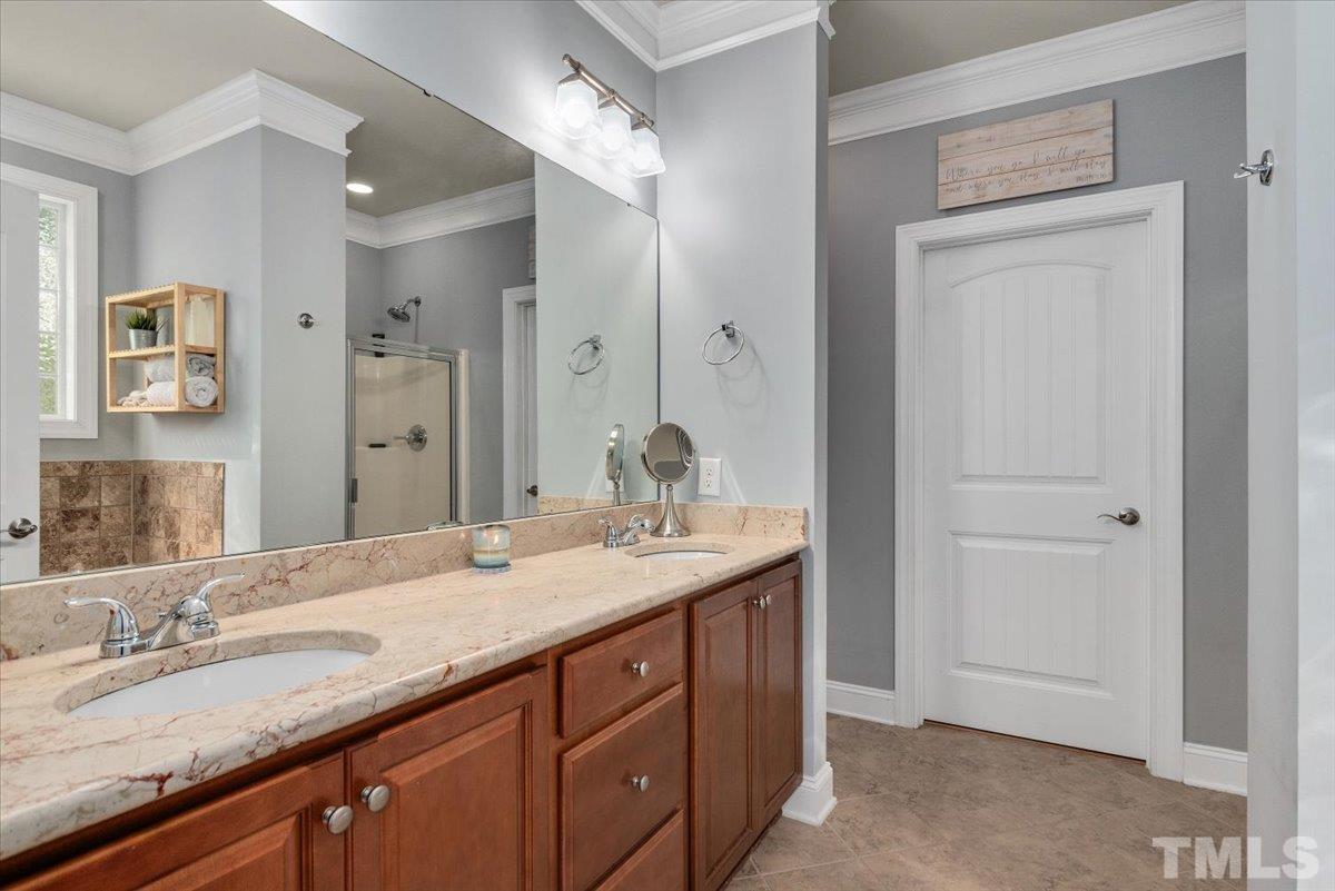 6 Piccadilly Court Durham, NC 27713 - Photo 20 of 27 a bathroom with a granite countertop sink and a mirror