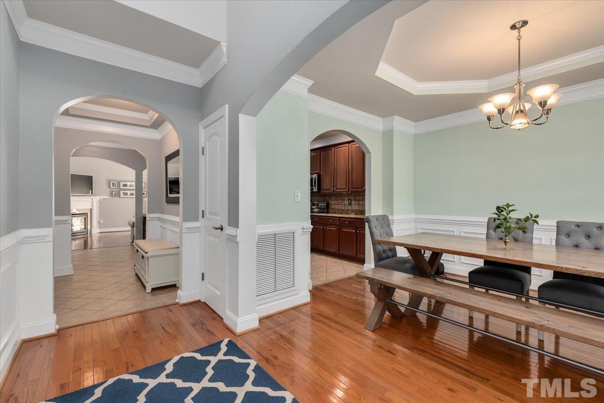 6 Piccadilly Court Durham, NC 27713 - Photo 3 of 27 a living room with furniture and a chandelier