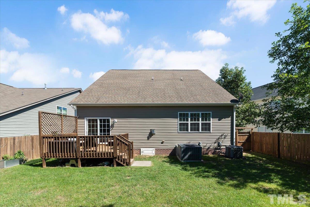 6 Piccadilly Court Durham, NC 27713 - Photo 23 of 27 a backyard of a house with table and chairs