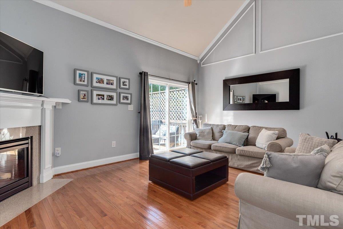 6 Piccadilly Court Durham, NC 27713 - Photo 10 of 27 a living room with furniture and a flat screen tv