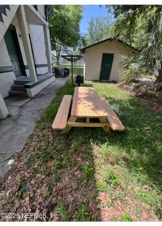 a view of backyard with deck