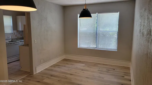 a view of an empty room with a window