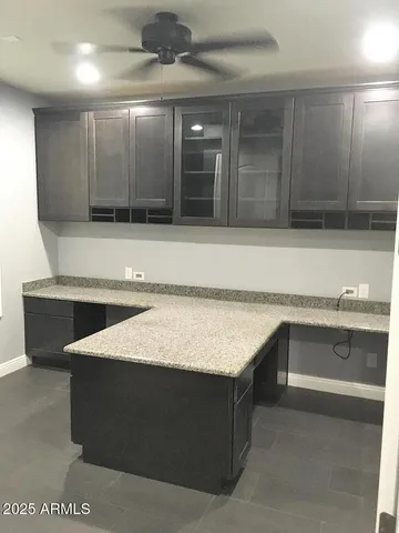 a kitchen with a cabinets and chandelier