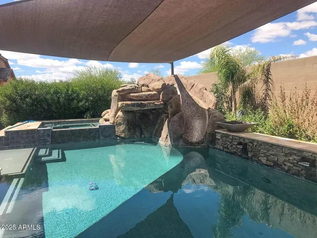 a view of a yard with furniture