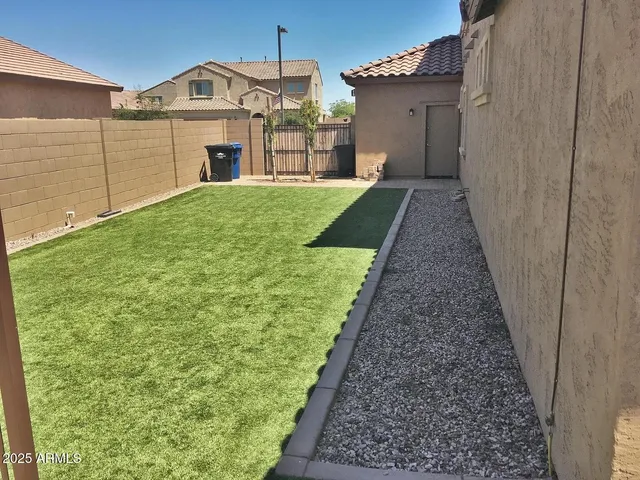 a view of a back yard of the house