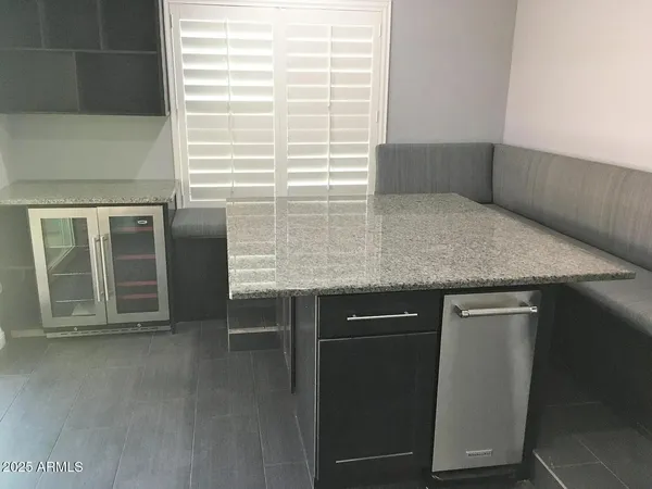 a view of a brick house with a large window