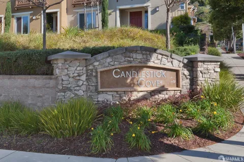 a sign broad in front of the red brick house