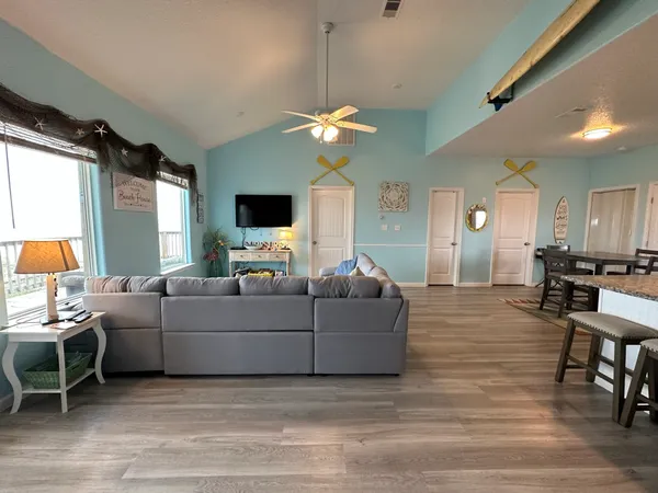 a kitchen with a table chairs stove and cabinets