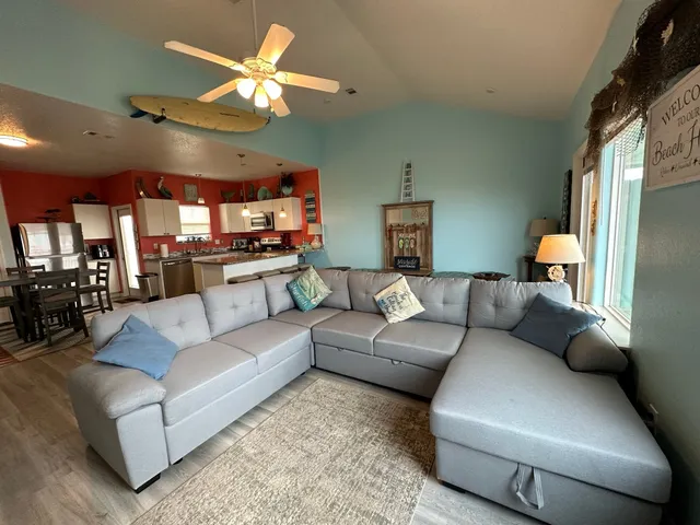 a large kitchen with stainless steel appliances granite countertop a stove and a sink