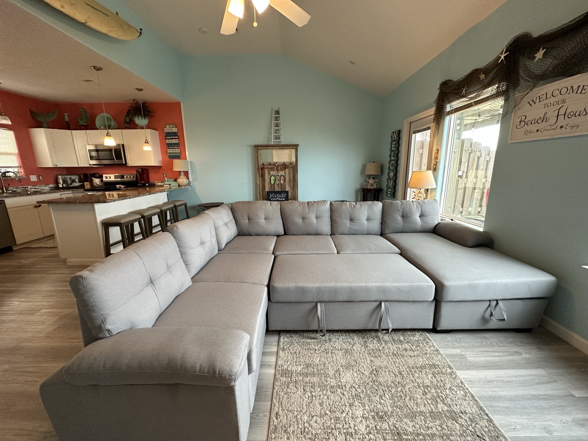 124 Howard Avenue, Unit D Surfside Beach, TX 77541 - Photo 14 of 50 a living room with furniture and a large window