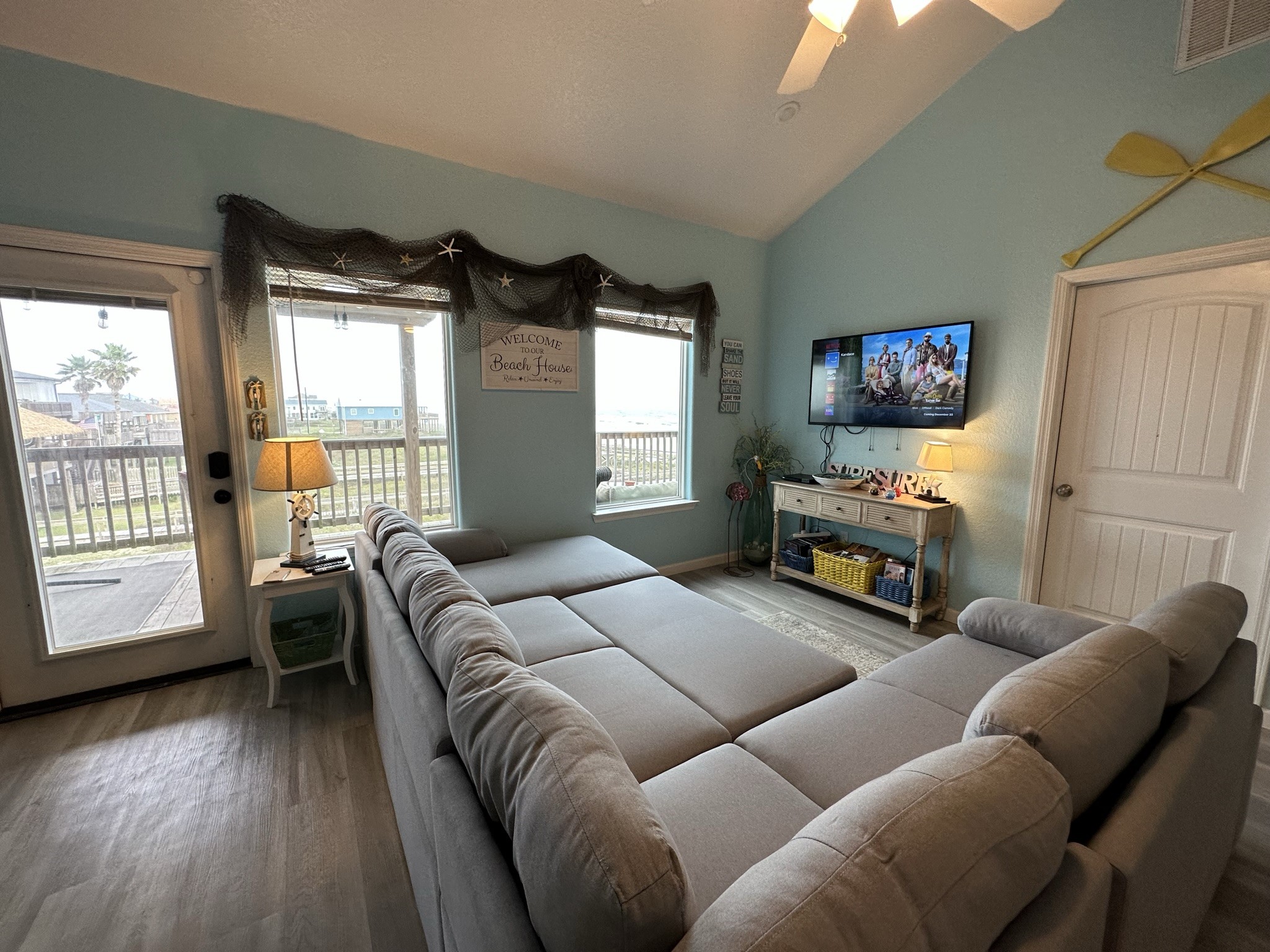124 Howard Avenue, Unit D Surfside Beach, TX 77541 - Photo 15 of 50 a bedroom with furniture and a flat screen tv