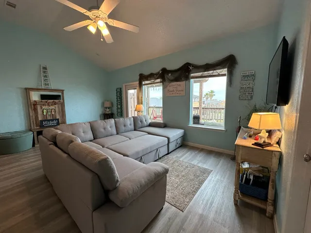 a bedroom with a bed and a television