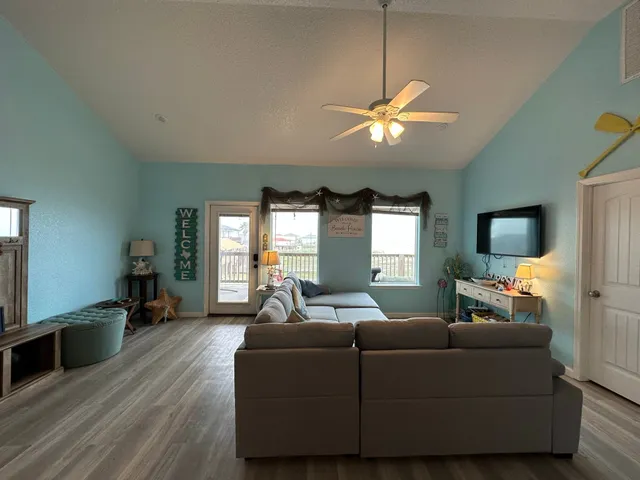 a bathroom with a sink mirror and shower
