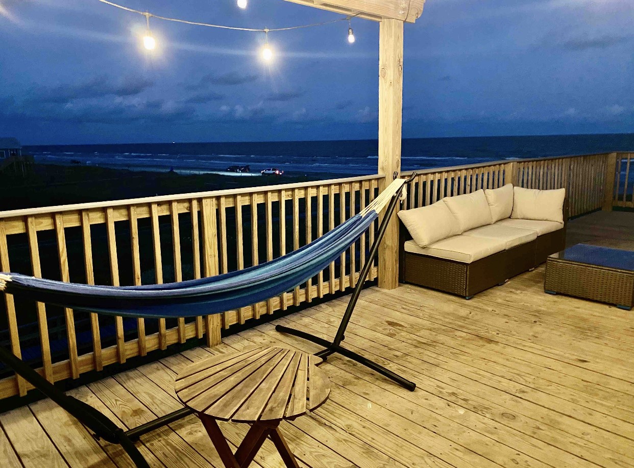 124 Howard Avenue, Unit D Surfside Beach, TX 77541 - Photo 2 of 50 a view of balcony with wooden floor