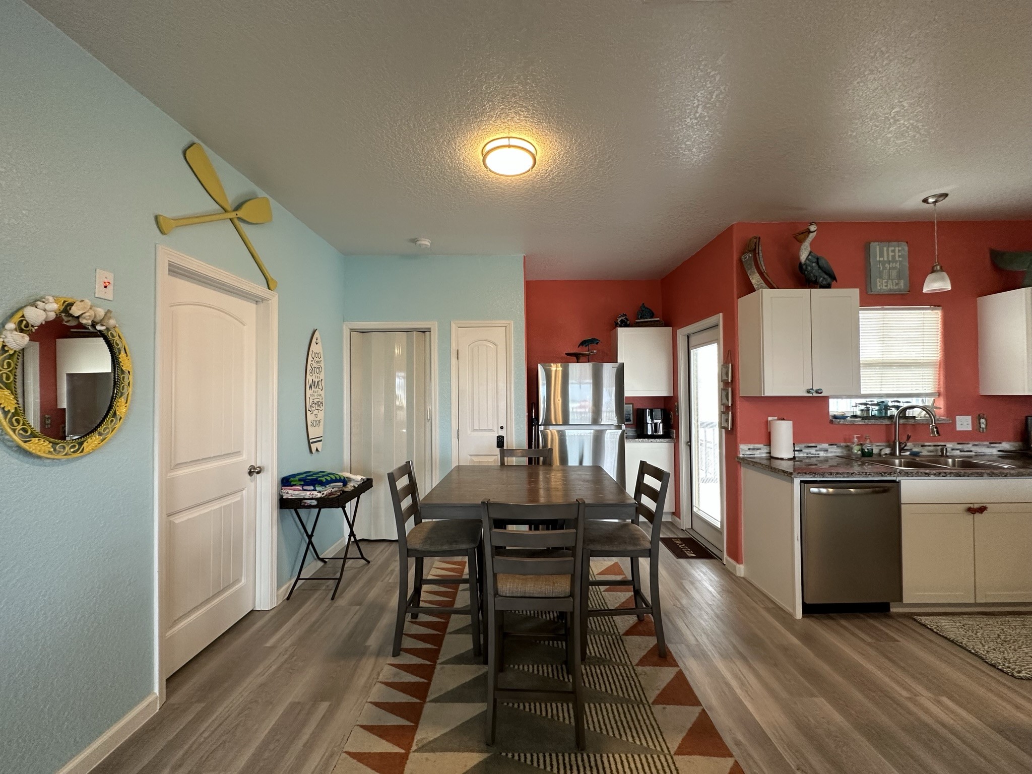 124 Howard Avenue, Unit D Surfside Beach, TX 77541 - Photo 22 of 50 a kitchen with a table and chairs in it