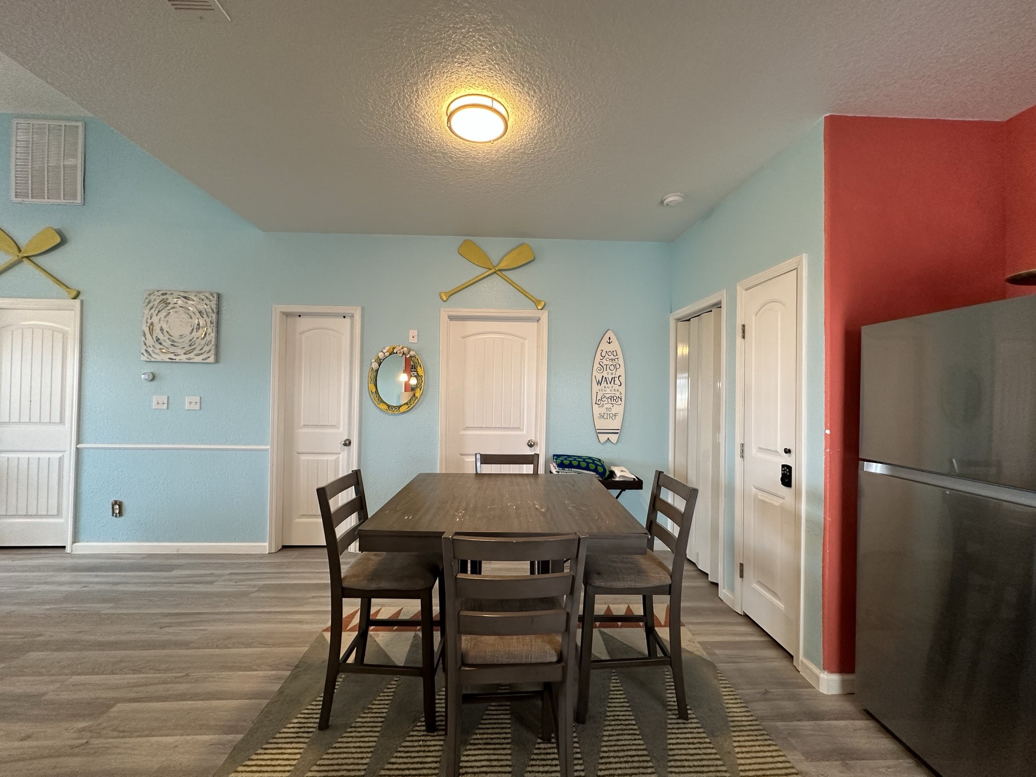 124 Howard Avenue, Unit D Surfside Beach, TX 77541 - Photo 23 of 50 a view of a dining room with furniture and wooden floor