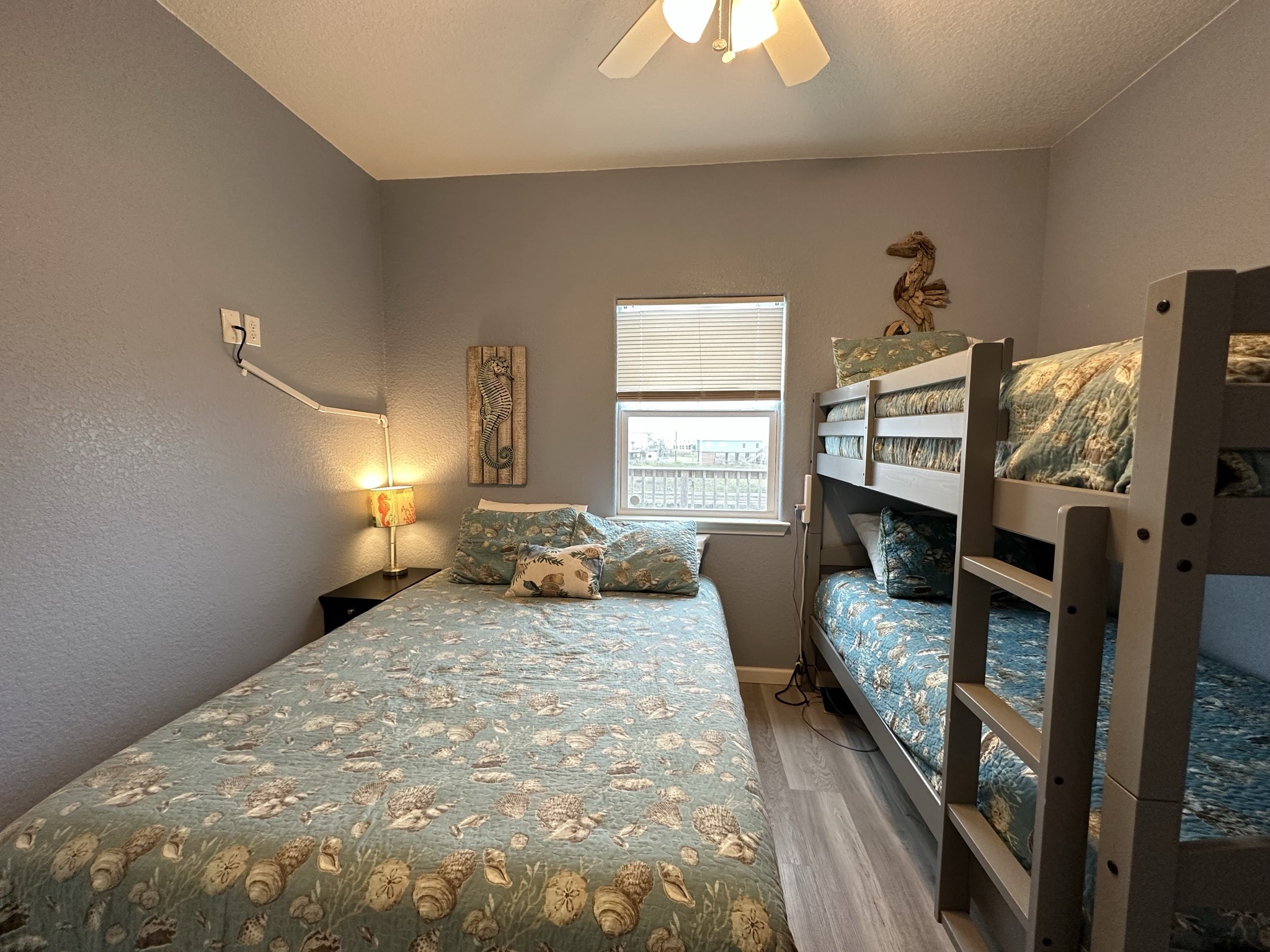 124 Howard Avenue, Unit D Surfside Beach, TX 77541 - Photo 30 of 50 a bedroom with furniture and a window