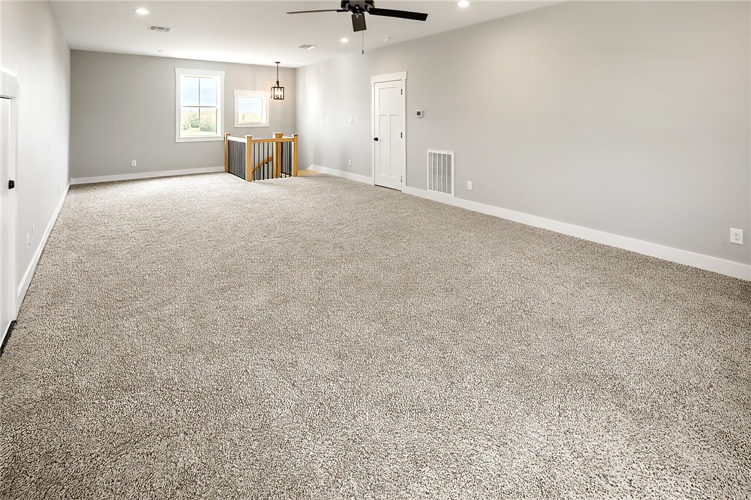 7323 River Ridge Drive College Station, TX 77845 - Photo 25 of 39 a view of an empty room with a kitchen