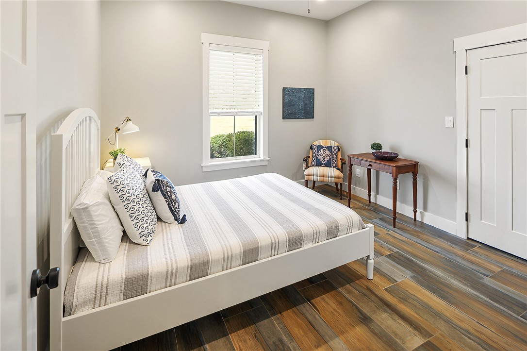 7323 River Ridge Drive College Station, TX 77845 - Photo 27 of 39 a bedroom with a bed and a window