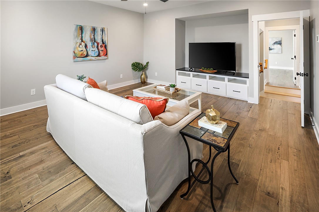 7323 River Ridge Drive College Station, TX 77845 - Photo 29 of 39 a living room with furniture and a flat screen tv