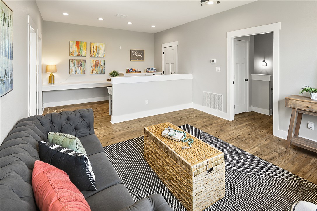7323 River Ridge Drive College Station, TX 77845 - Photo 35 of 39 a living room with furniture and a open kitchen view