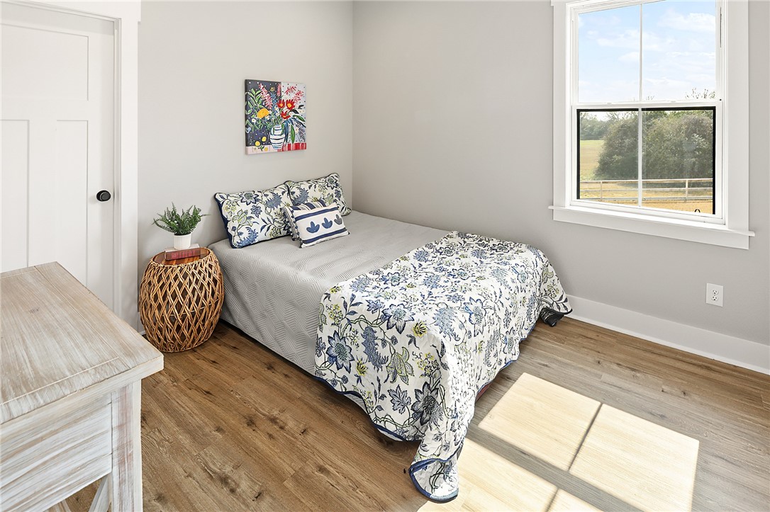 7323 River Ridge Drive College Station, TX 77845 - Photo 36 of 39 a bedroom with a bed and a window