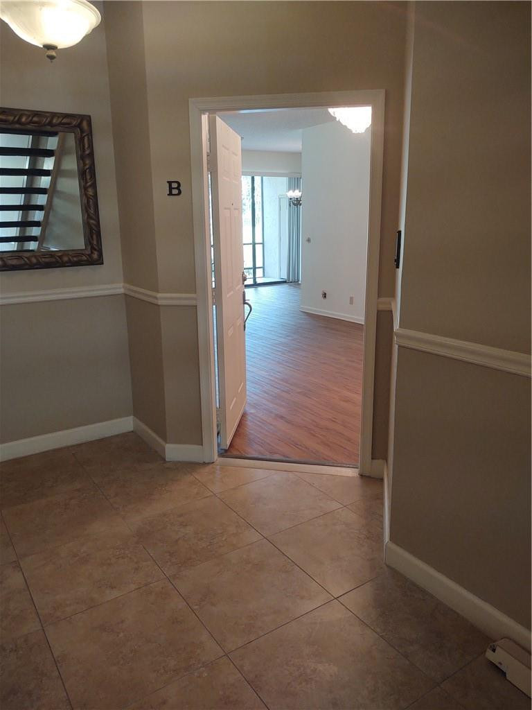 5801 Coach House Circle, Unit B Boca Raton, FL 33486 - Photo 7 of 39 Walking into the unit