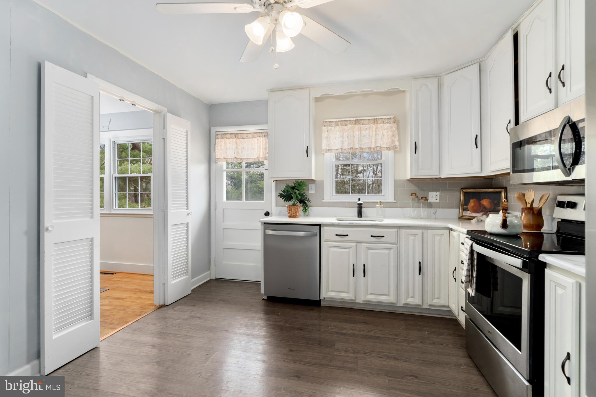 4406 Old Farm Road Baldwin, MD 21013 - Photo 15 of 49 a kitchen with a sink stove and cabinets
