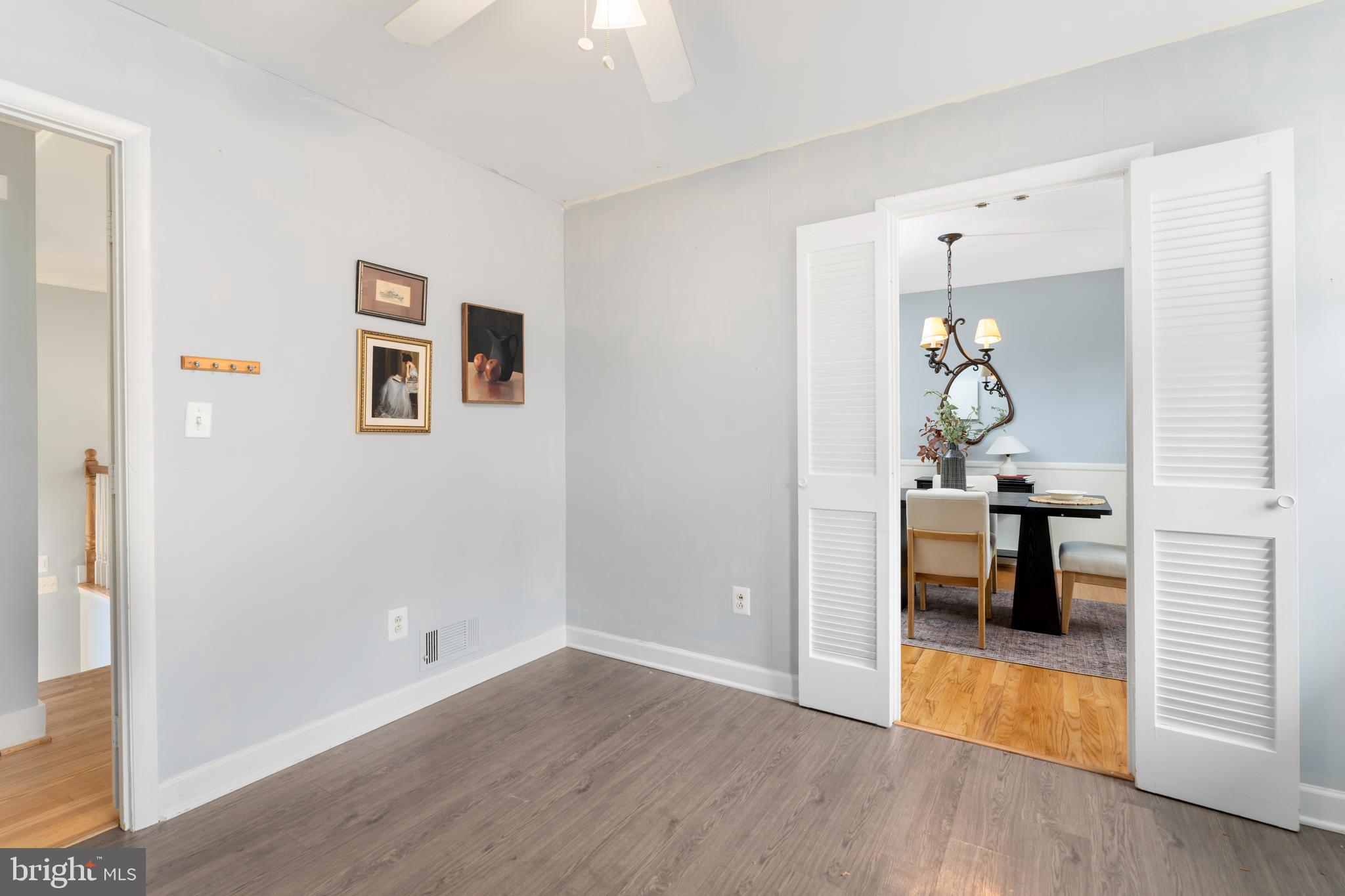 4406 Old Farm Road Baldwin, MD 21013 - Photo 18 of 49 a view of a hallway with wooden floor fireplace and living room