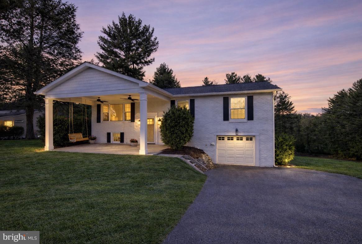 4406 Old Farm Road Baldwin, MD 21013 - Photo 2 of 49 a front view of a house with a yard and garage